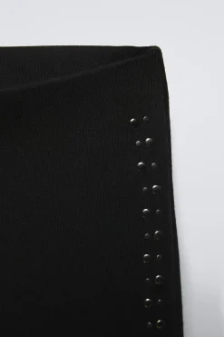 CALÇAS À BOCA DE SINO COM BOTÕES DE PRESSÃO-ZARA New