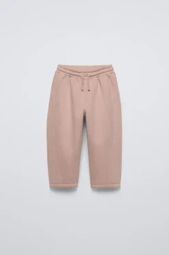 CALÇAS COM CORTES E ETIQUETA-ZARA Fashion