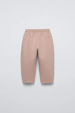 CALÇAS COM CORTES E ETIQUETA-ZARA Fashion