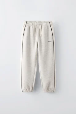 CALÇAS COM FAIXAS E DEBRUADOS EM CONTRASTE-ZARA Cheap