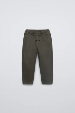 CALÇAS ÀS RISCAS COM PADRÃO-ZARA Discount